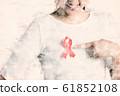 Closeup of red badge ribbon on woman chest 61852108