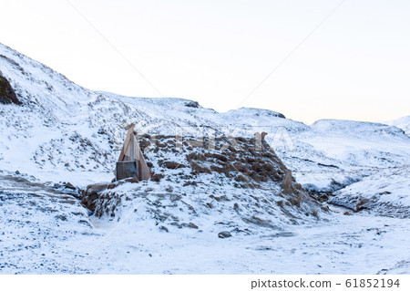 An old bathhouse with a hot spring in the 61852194