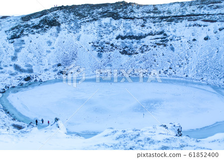 Kerid lake frozen in winter in the crater of an Kerid lake frozen in winter in the crater of an 61852400