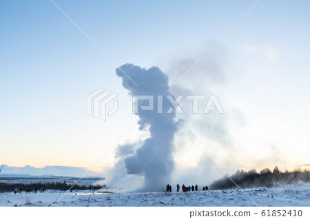 An erupting soaring geyser in the Valley of 61852410