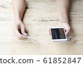 woman use mobile smartphone and credit card for online shopping 61852847