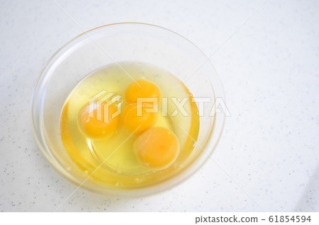 Twin eggs (two yellow eggs) 61854594