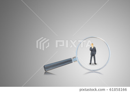 Magnifying glass looking at businessman. Magnifying glass looking at businessman. 61858166