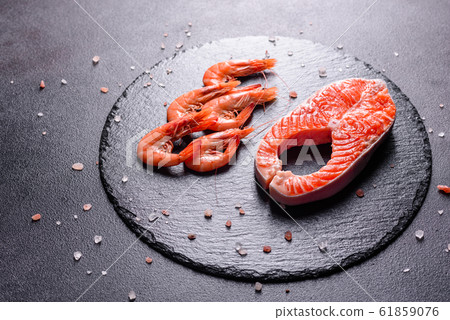 Raw trout red fish steak served with herbs Raw trout red fish steak served with herbs 61859076