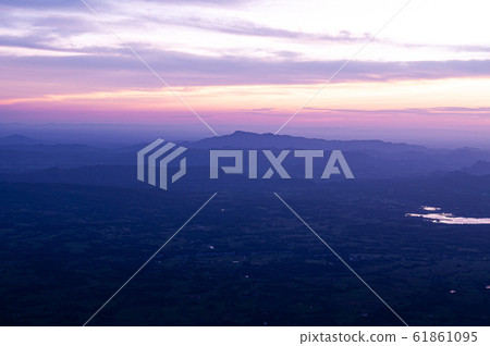 Beautiful Asian limestone mountain landscape dramatic sunrise at Pha Nok An cliff. Phu Kradueng - Thailand 61861095