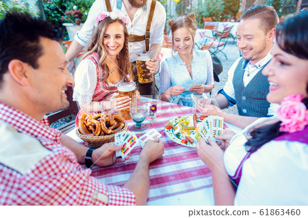 Traditional card game in a German beer garden 61863460