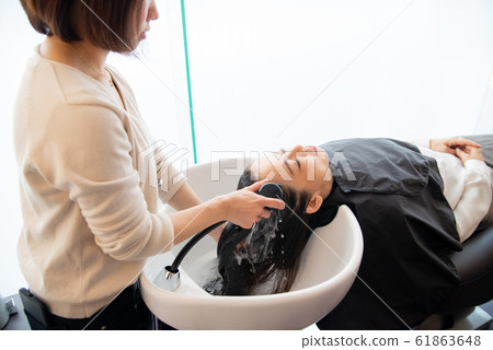 Senior woman caring for a hairdresser Senior woman caring for a hairdresser 61863648