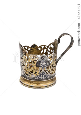 Old vintage Cup holder made of white metal. Close Old vintage Cup holder made of white metal. Close 61864291