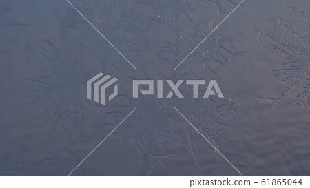Snowflakes on the window in supermacro shooting. 61865044