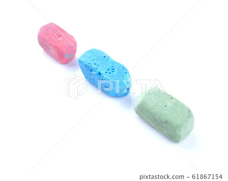 colored chalks on a white background colored chalks on a white background 61867154