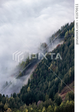 Cable car gondolas moving across the Alps mountain Cable car gondolas moving across the Alps mountain 61870011