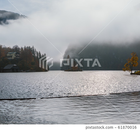 Mountain alpine autumn misty morning lake Mountain alpine autumn misty morning lake 61870016
