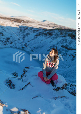 Beautiful girl on the background of lake Kerid Beautiful girl on the background of lake Kerid 61871298