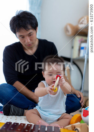 Dad playing with 6 month old baby Dad playing with 6 month old baby 61873900