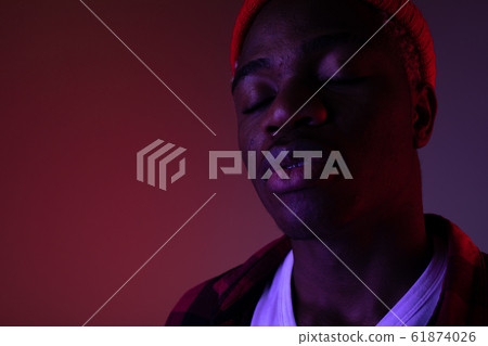 portrait of a stylish handsome american black man in neon light portrait of a stylish handsome american black man in neon light 61874026