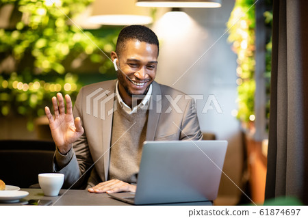 Smiling black business man making video call to family 61874697