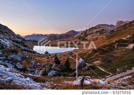 Early morning autumn alpine Dolomites mountain 61875038