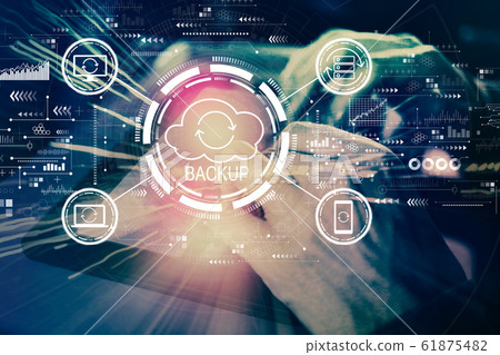 Backup concept with man using tablet Backup concept with man using tablet 61875482