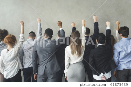 Protest group of business peopel hands showing clenched fists Protest group of business peopel hands showing clenched fists 61875489