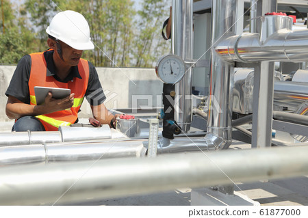 The system engineer is checking the pressure and 61877000