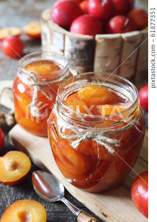 Autumn sweet. Homemade red plums jam in two jars 61877351