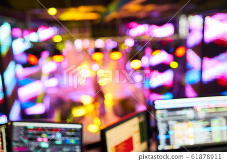 Dj mixes the track in the nightclub at party. In the background laser light show Dj mixes the track in the nightclub at party. In the background laser light show 61878911