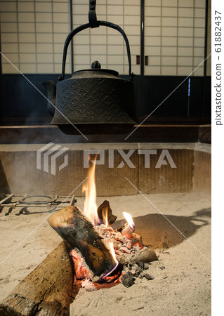 Iron bottle in the hearth 61882437