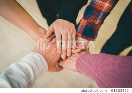 Unity hands together cooperation 61883422