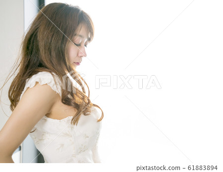 Woman with closed eyes Woman with closed eyes 61883894