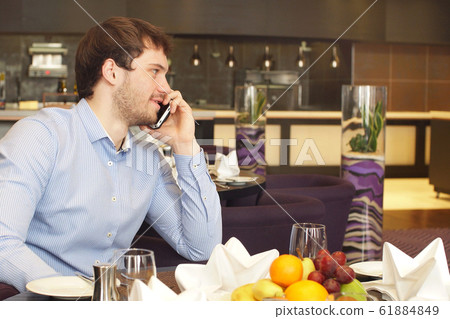 Awesome handsome businessman in restaurant Awesome handsome businessman in restaurant 61884849