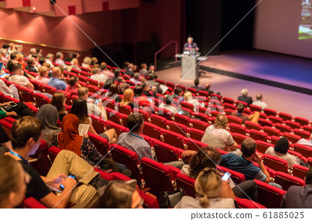 Business speaker giving a talk at business conference event. Business speaker giving a talk at business conference event. 61885025