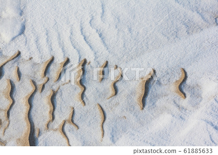 Snow and sand by the river, natural background Snow and sand by the river, natural background 61885633