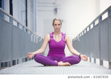 young active women doing yoga at outdoor 61887830