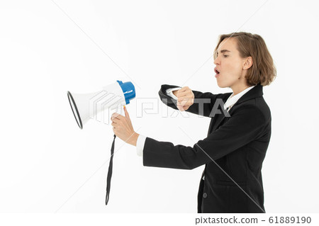 Young business woman is shouting through a Young business woman is shouting through a 61889190
