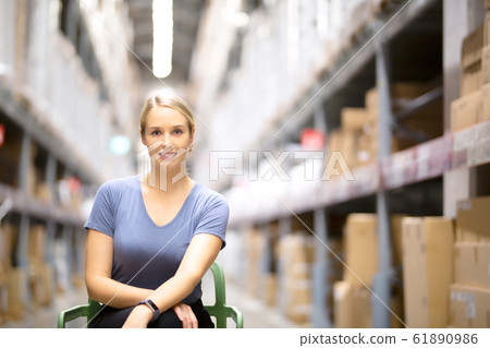 portrait shot of young women enjoy shopping in hardware store against shelf rack  61890986