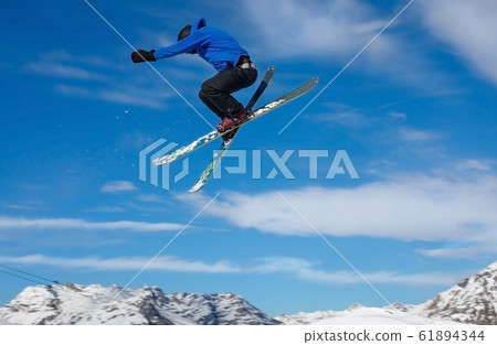 Skier jumps in snow park, big air 61894344