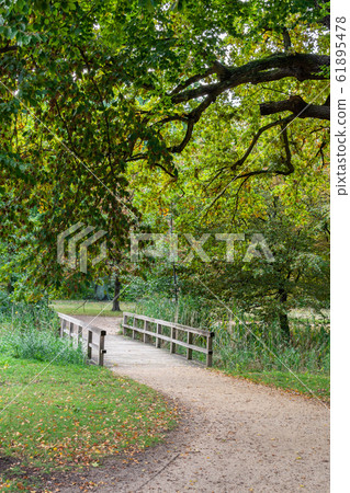 Walking in the palace garden of Charlottenburg Walking in the palace garden of Charlottenburg 61895478