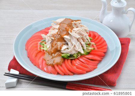 Stick chickens (stick chickens, bun bungee). Chinese cuisine of chicken breast, cucumber and tomato. 61895801