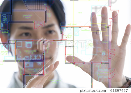 A male businessman in a state-of-the-art first-class architect office that projects drawings on an aerial display and performs presentation operations A male businessman in a state-of-the-art first-class architect office that projects drawings on an aerial display and performs presentation operations 61897437