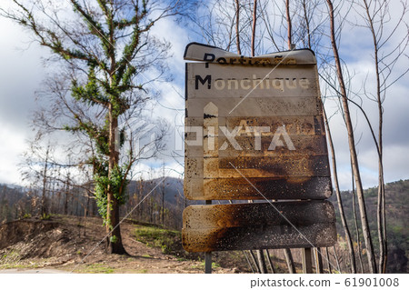 Burnt sign on the road after a forest fire in Monchique, Portugal. Portimao, Monchique, Alcaria do Peso, village name, weight. 61901008