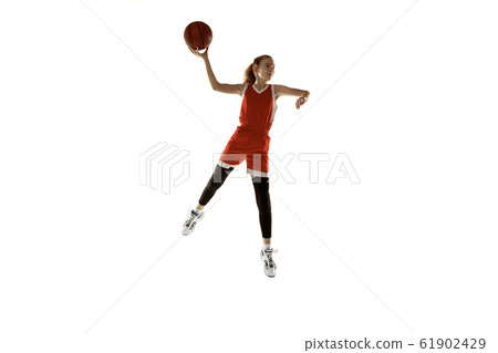 Young caucasian female basketball player against white studio background Young caucasian female basketball player against white studio background 61902429