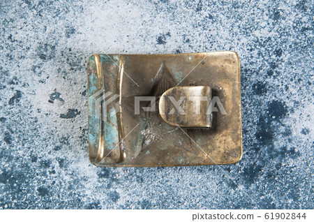 Old brass belt buckle with a star 61902844