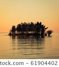 Small island in the Ladoga lake. Sunset on Valaam. 61904402