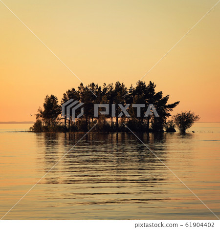 Small island in the Ladoga lake. Sunset on Valaam. Small island in the Ladoga lake. Sunset on Valaam. 61904402