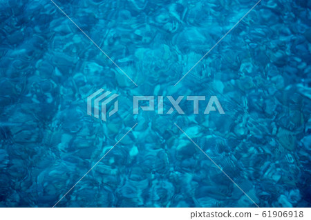 Magnificent blue surface of some water source with 61906918