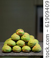 Tasty Mini Green Tea Choux au Craquelin or French  Crunchy Cream Puff filled with delicious and creamy Chantilly Cream.  61909409