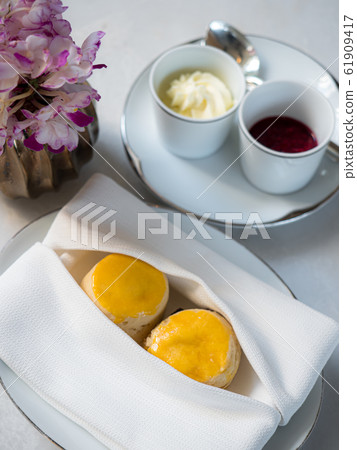 A tasty and delicious set of freshly baked scones A tasty and delicious set of freshly baked scones 61909417