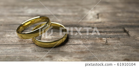 gold wedding rings on wooden table soft focus macro shot 3d render illustration 61910104