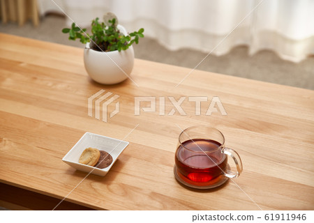 Afternoon in the living room_Tea, cookies and houseplants Afternoon in the living room_Tea, cookies and houseplants 61911946