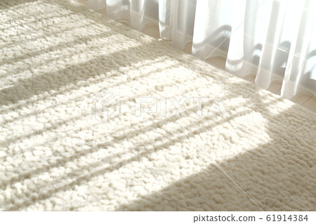 Gentle sunlight through the curtain 61914384